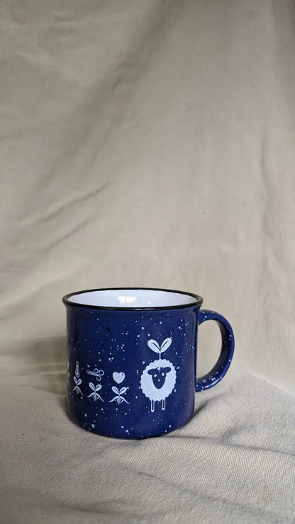 Blue ceramic EcoWool mug with white interior and EcoWool logo on it